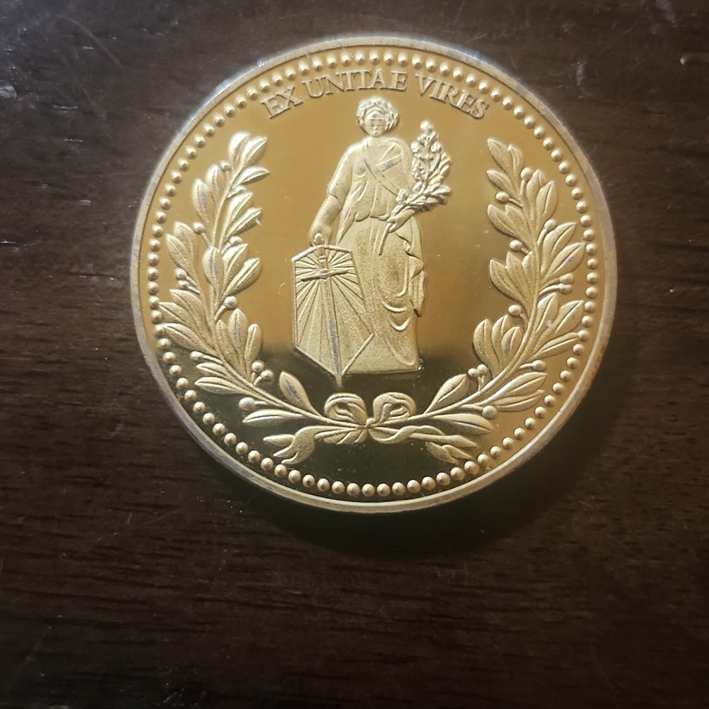 24K GOLD LAYERED JOHN WICK  EX UNITAE VIRES HOTEL COIN.